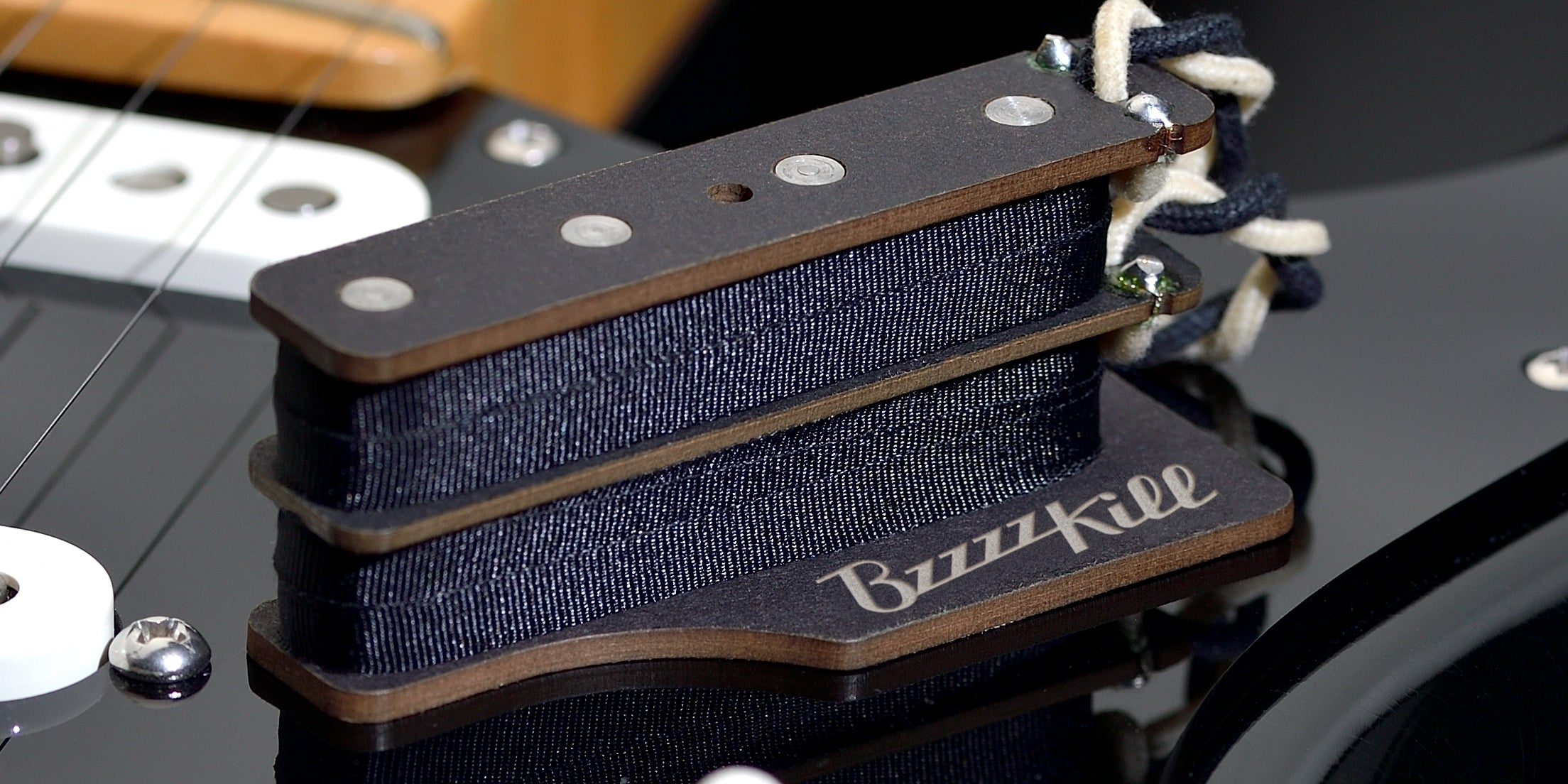 The BzzzzKill Dual Layer device for eliminating Fender Stratocaster 60 cycle hum in all pickup selector positions. On white background.