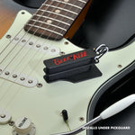The BzzzzKill Dual Layer Players Series device, sitting on a Stratocaster with text reading: Installs under pickguard.