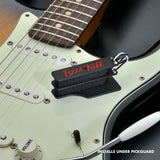 The BzzzzKill Dual Layer Players Series device, sitting on a Stratocaster with text reading: Installs under pickguard.